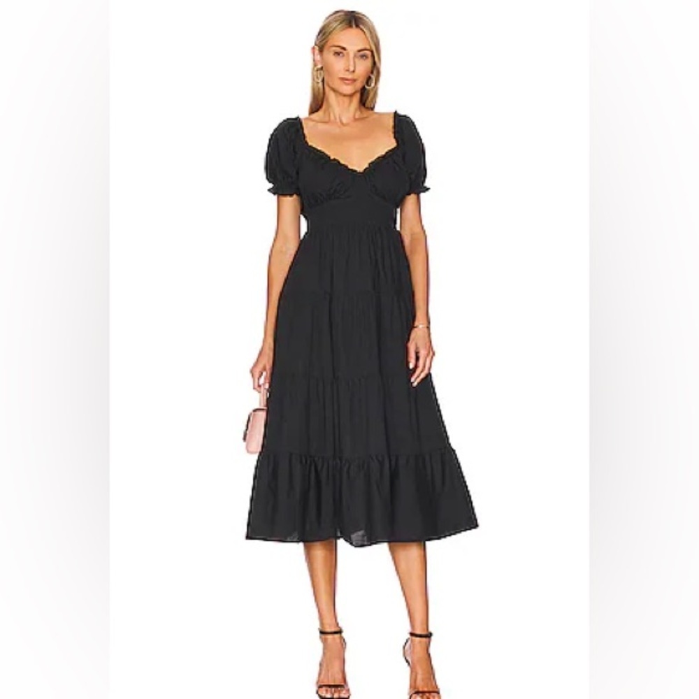 Astr puff sleeve with elastic waist at back and side zipper. NWT. Size XS.